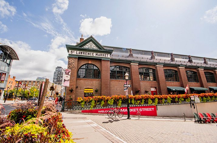 The exterior of the St. Lawrence Market, a historic brick building in Toronto