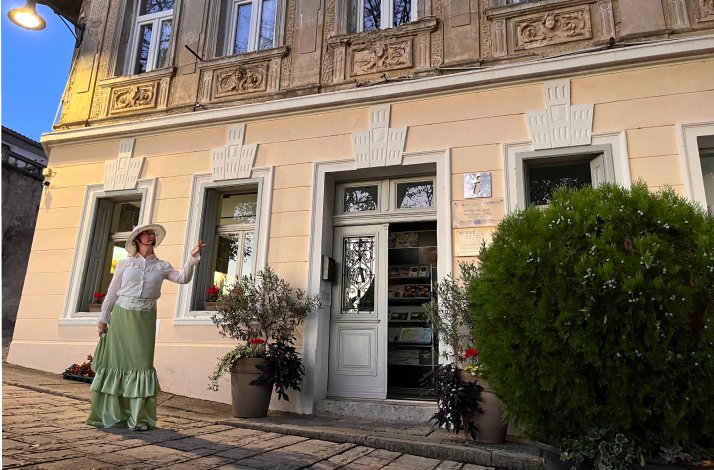 Costumed guide in front of the Buzet Tourist Office building, Istria.
