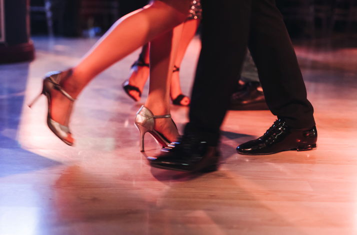 A close-up view of dancers' feet at Bachata Studio.