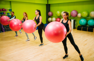Women exercising with fitness balls.