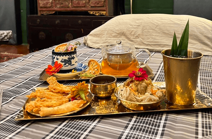 Herbal tea set and Thai snacks served in VIP massage room at Baan Ya Hom, Bangkok.