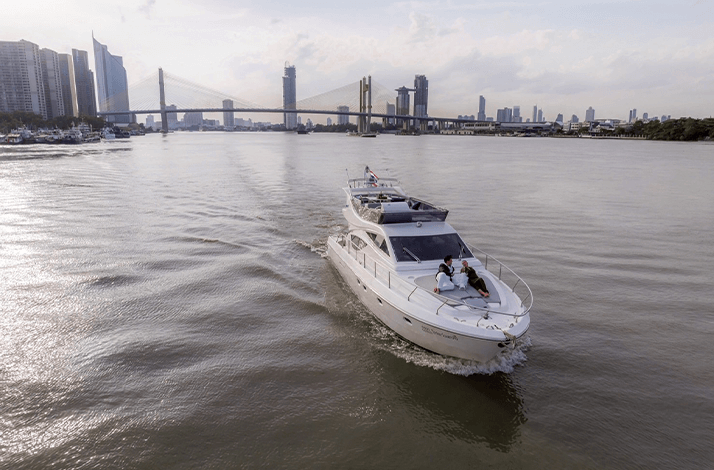 A yacht from the VeyRah Yacht Club on the Chao Phraya River in Bangkok, Thailand