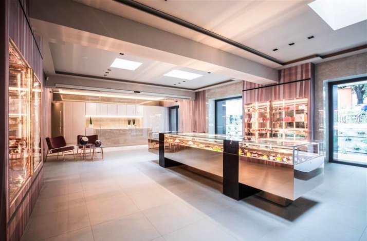 The interior of Italian pastry chef Damiano Carrara's flagship Atelier Damiano Carrara showcases desserts display cases.