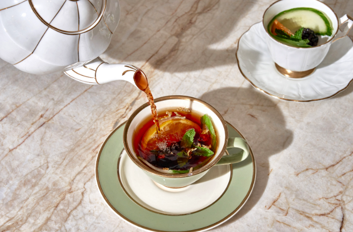 Pimm's Cup cocktail being poured into a teacup at Caffe Dante