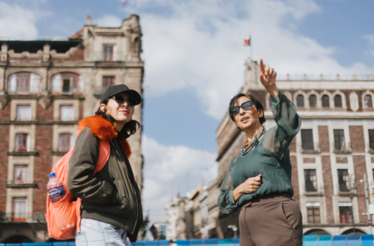 A person and a guide on the tour in Mexico City