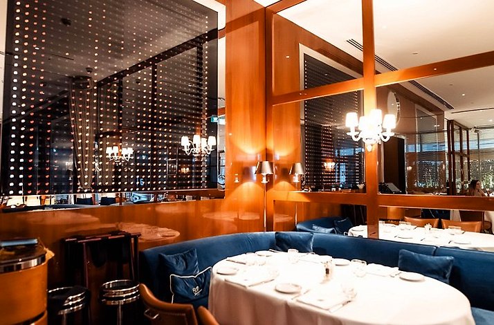 The sophisticated, nautical-inspired dining room overlooking the Marina at Restaurant Cipriani Dubai.