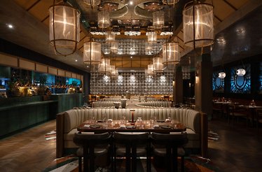 The stylish, art-driven space of Restaurant Clay Dubai, featuring dramatic lighting and an elegant design.