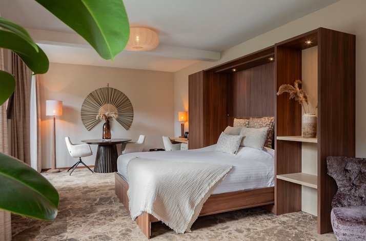 Modern bedroom with wooden bed frame and neutral decor