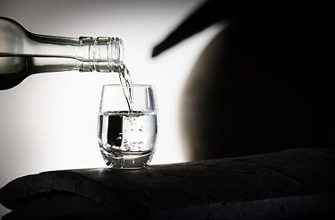 The moment of pouring Soju into a glass.