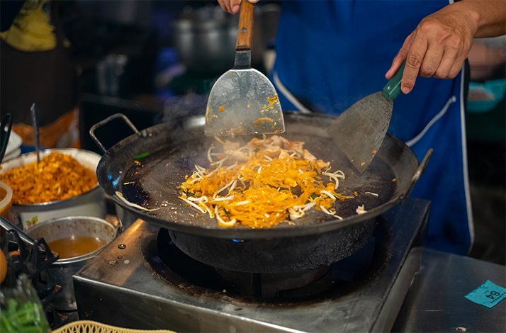 Sample northeastern Thai dishes, pad Thai, and homestyle snack