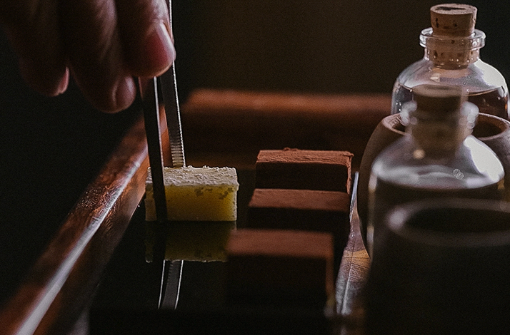 A close up shot of the process of  mezcal tasting with chocolate,