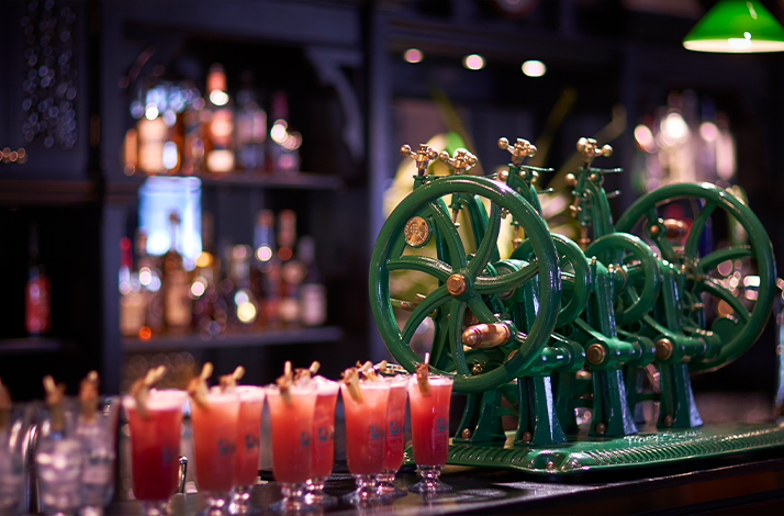 Singapore Sling and sack of peanuts with green vintage machines