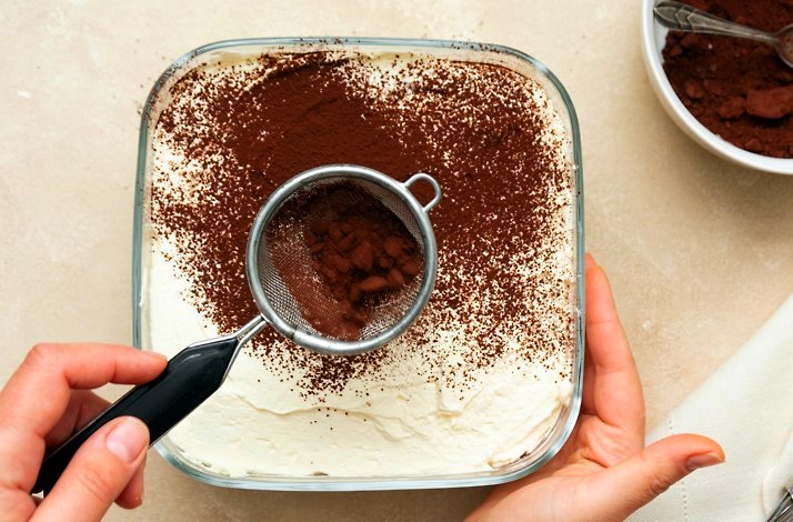 A person making tiramisu at a chef-led masterclass at Eataly Flatiron.