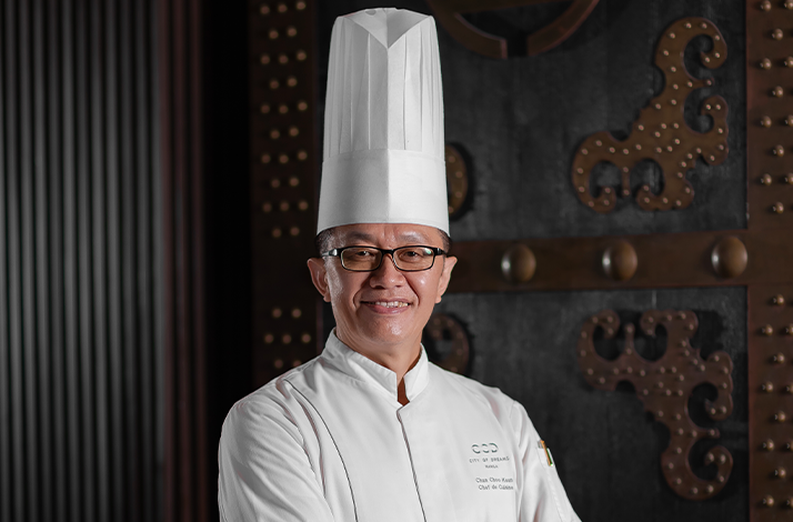 Crystal Dragon's Executive Chef Chan Choon Kean posing in restaurant.