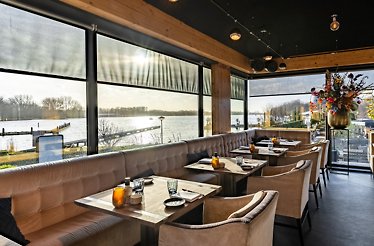 Tables lined up at Het Bosch Waterfront Kitchen.