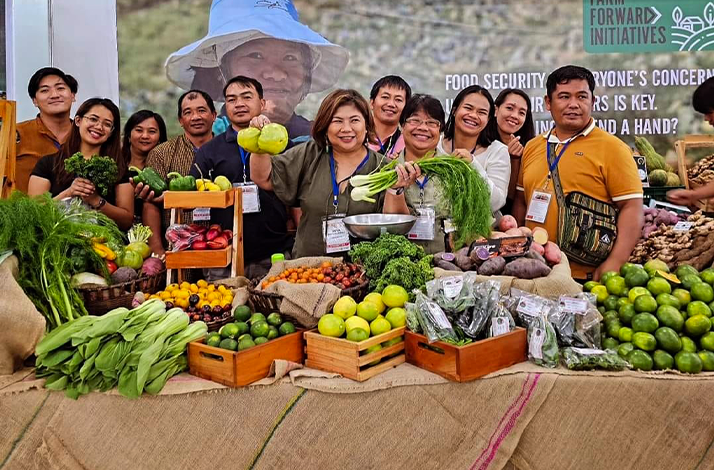 Display of assorted fresh vegetables and fruits at a local farm trading post in Benguet