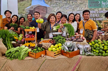 Display of assorted fresh vegetables and fruits at a local farm trading post in Benguet