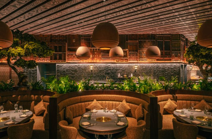 Cozy interior with set tables of HANU restaurant in Dubai.