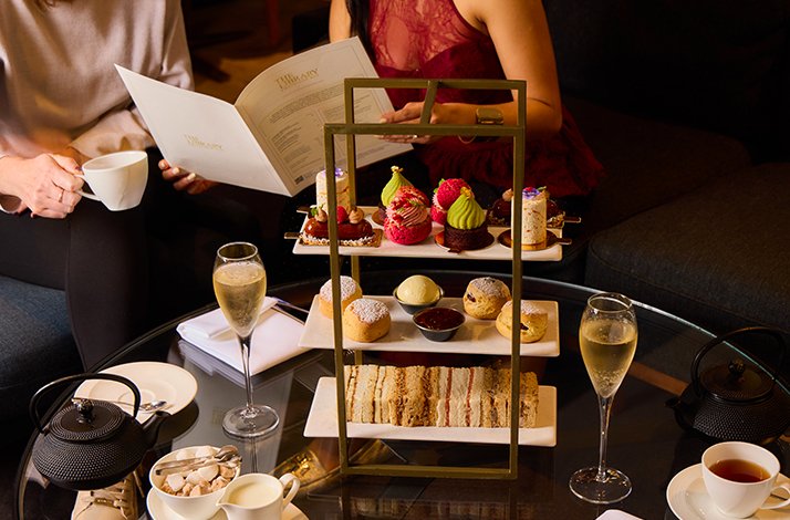 Afternoon tea with scones, pastries, and wine served at  The Edwardian Hotel Manchester.