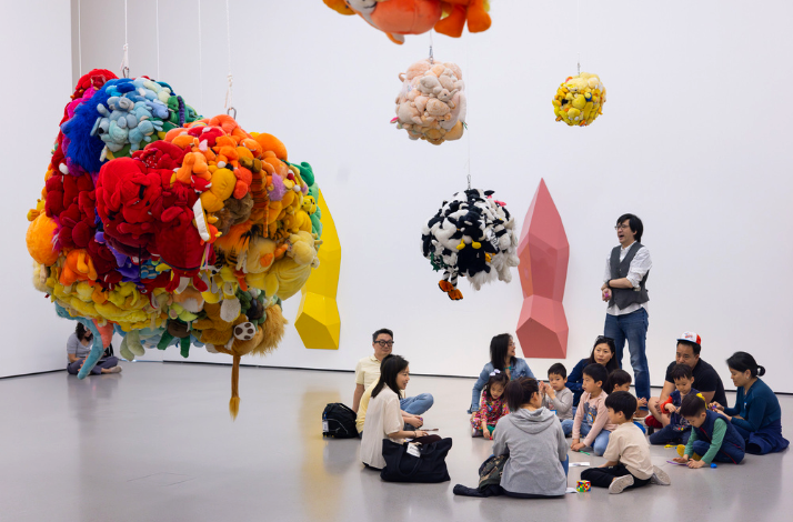 A group of people on a tour of the Museum of Modern Art.