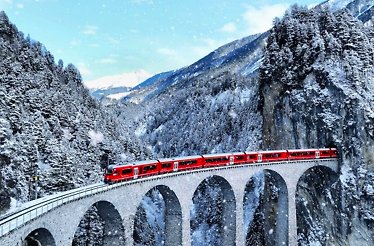 Bernina red train on the alps 