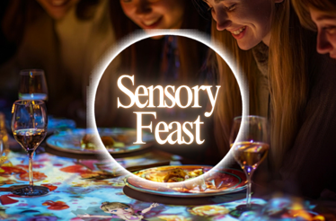 People enjoying an immersive dining experience with overlay text 'Sensory Feast'.