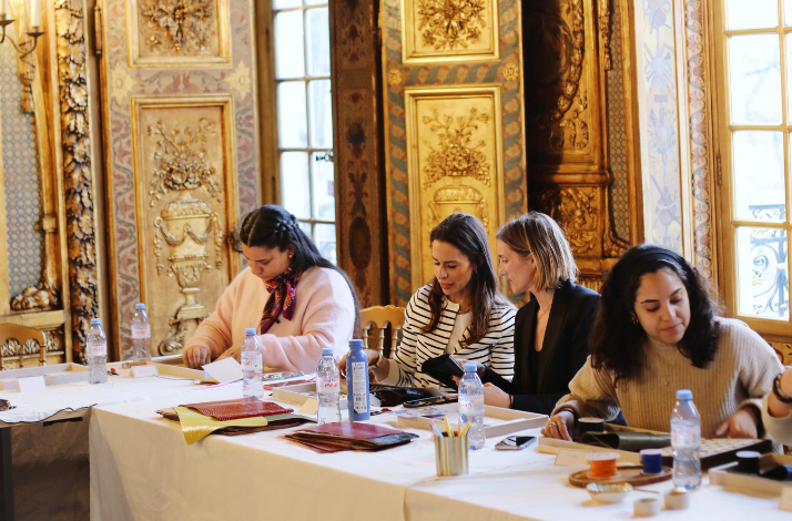 A group of women participating in a craft work.