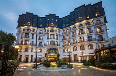 Elegant luxury hotel exterior at dusk