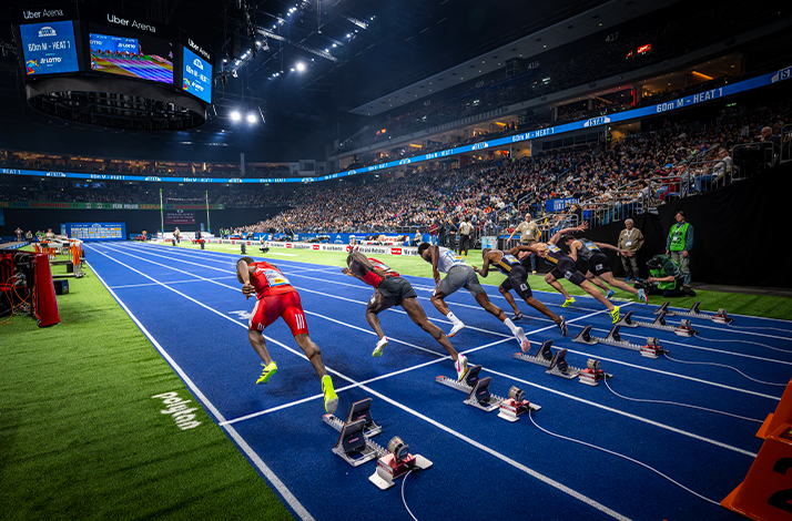 Sprinters exploding out of the starting blocks at Uber Arena.