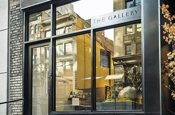 The Gallery by Odo restaurant entrance with large glass windows and door.