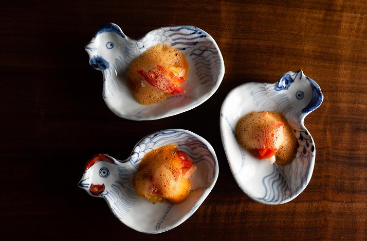 Three small bird-shaped porcelain bowls with dishes.