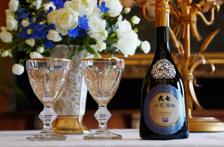 Daishichi sake bottle and tasting glasses for an exclusive sake pairing experience at Odo Lounge.