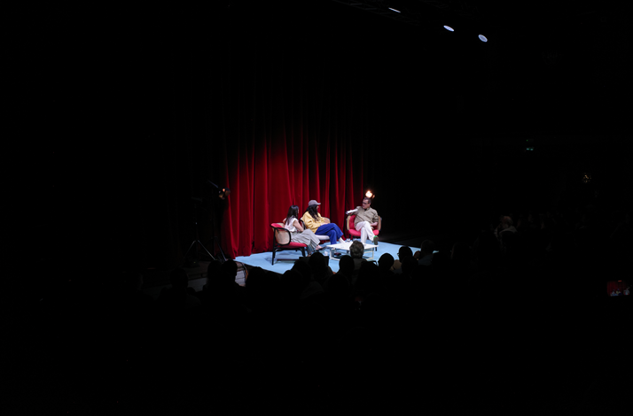 Live podcast recording on stage at Teatro Franco Parenti in Milan.