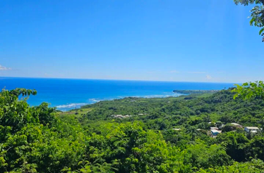 View from Cherry Tree Hill in Barbados, overlooking the coastline and lush greenery.