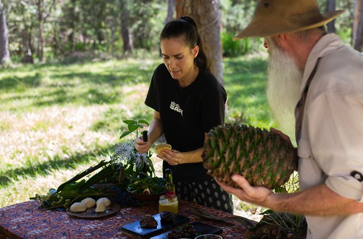 Rick J Petersen with an pineapple teaching how to survive with wild plants in nature.