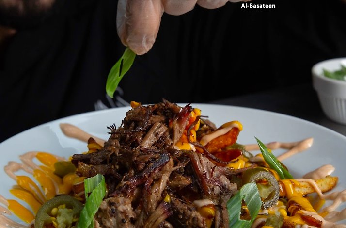 Chef decorating lebanese dish from AMAR Restaurant.