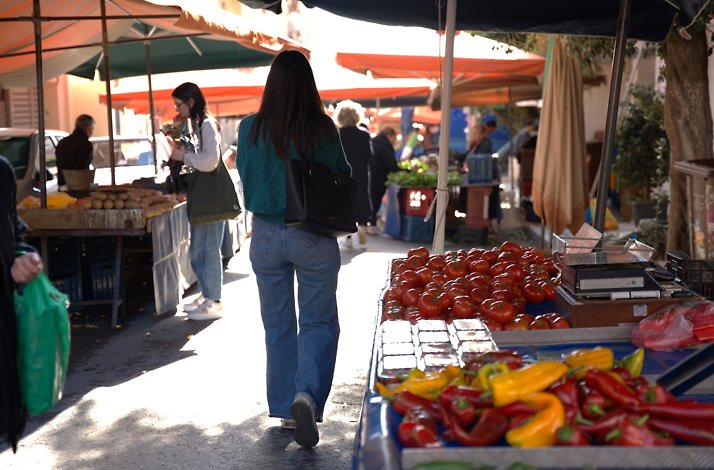 People shopping at an outdoor produce market.