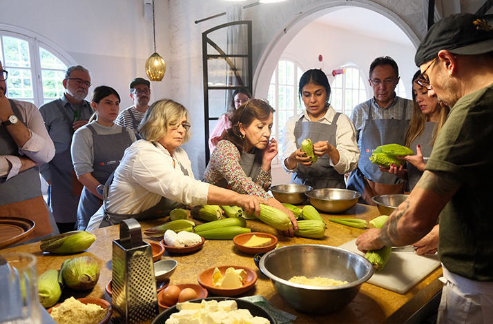 A juicy cut of meat served with a flavorful herb and spice topping, accompanied by fresh vegetables