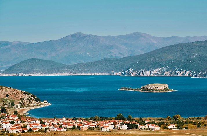 Scenic view of the Great Prespa Lake and nearby village, Greece.