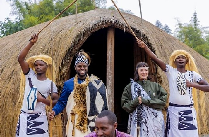Tourists posing with the locals in Iby'Iwacu Cultural Village