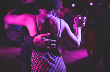 A view of the couple dancing tango.