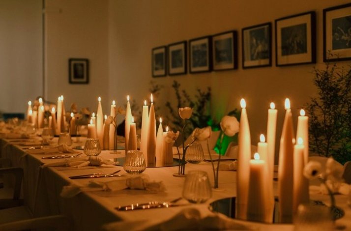 Table lit up with candles are served for guests at A Symphony of Soil & Soul by SecretEATS in South Africa's Highveld.