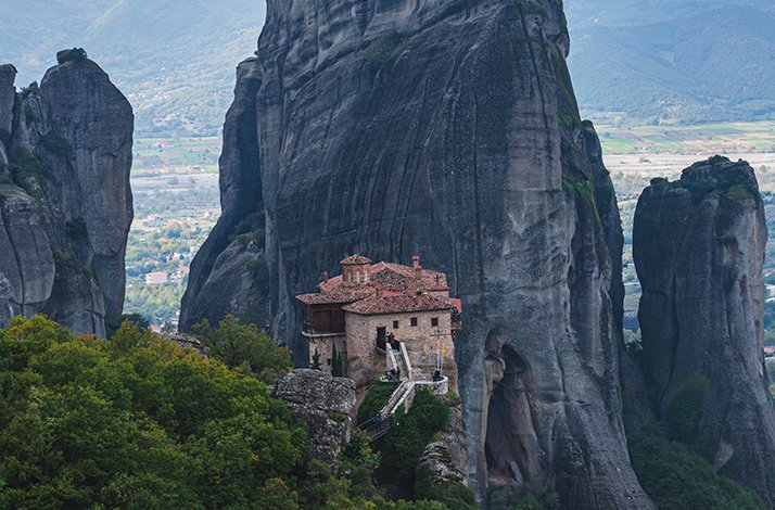 A scenic view of the Monastery of Rousanou in Meteora, Greece.