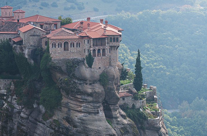 A scenic view of the Monastery of Rousanou in Meteora, Greece.