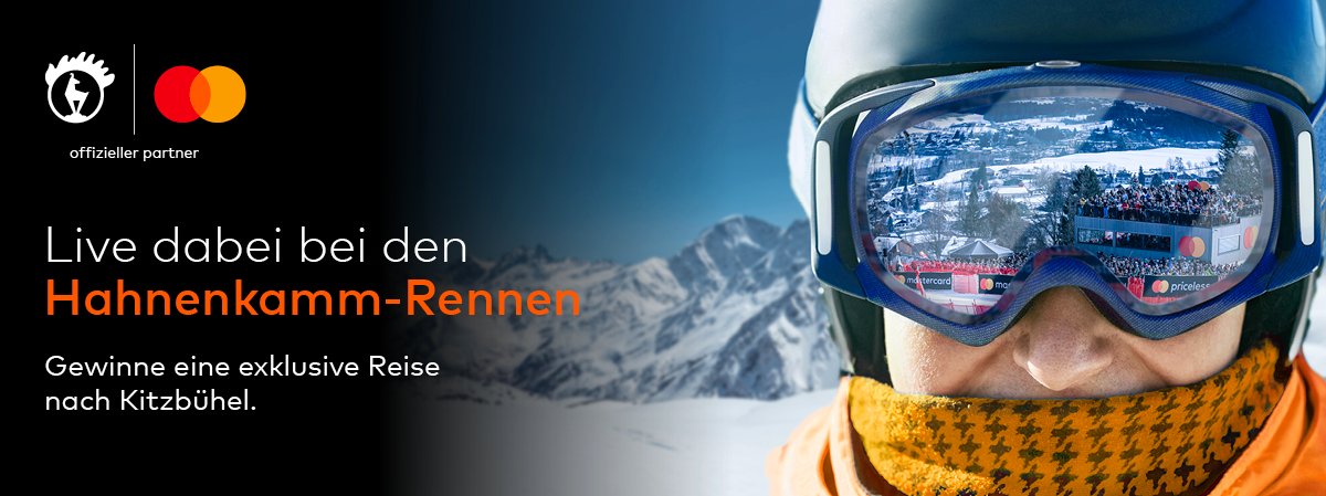 Werbebanner für die Hahnenkamm-Rennen. Rechts ist eine Person in orangefarbener Skibekleidung mit Skibrille zu sehen.