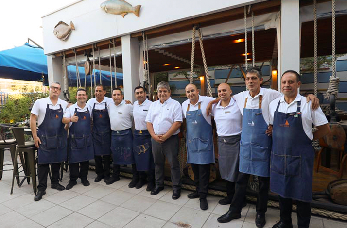 Coco restaurant team standing together, representing Chilean culinary tradition and hospitality.