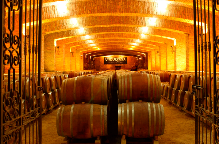 Wine casks at the centuries-old underground cellars of Viña Undurraga.