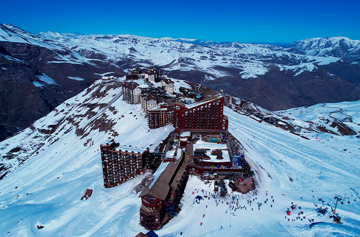 Aerial view of Valle Nevado Ski Center nestled in the Andes mountains during a winter day trip from Santiago.