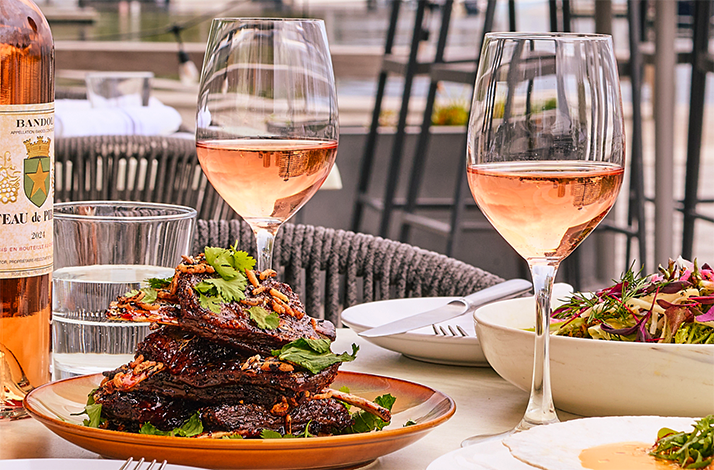 A table served with the dishes of the best New England produce paired with wine at Woods Hill Pier 4.
