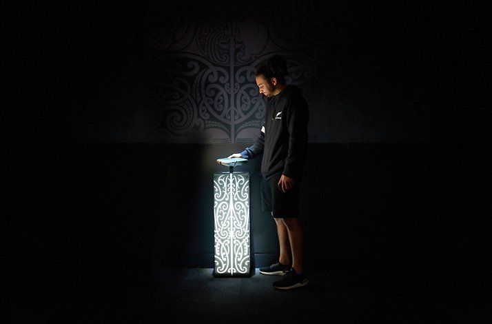 An experience during a guided tour at the All Blacks Experience in Auckland, New Zealand, showcasing Māori culture and rugby history.